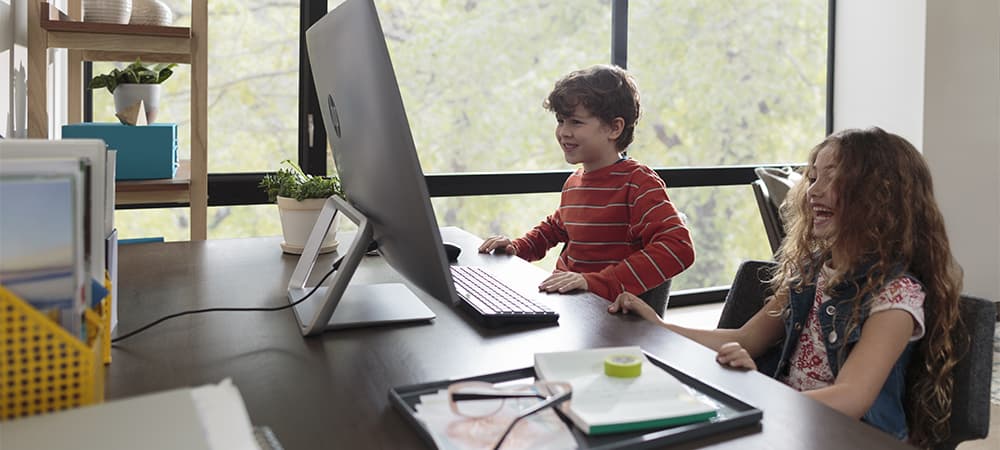 Kids laughing while watching a movie on the HP Pavilion All-in-One